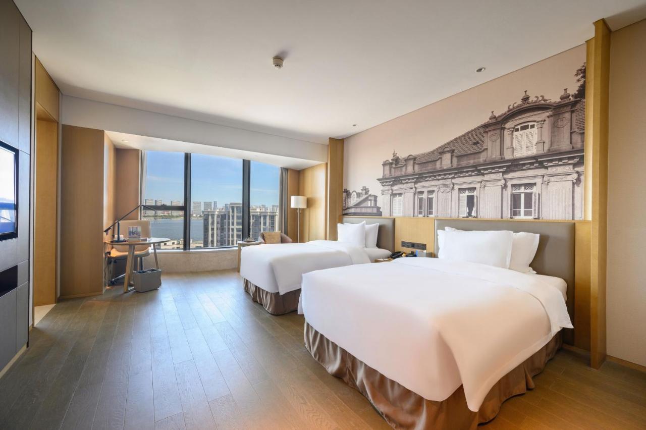 Отель Wyndham Grand Plaza Royale Yuzhou Xiamen Wuyuan Bay Экстерьер фото